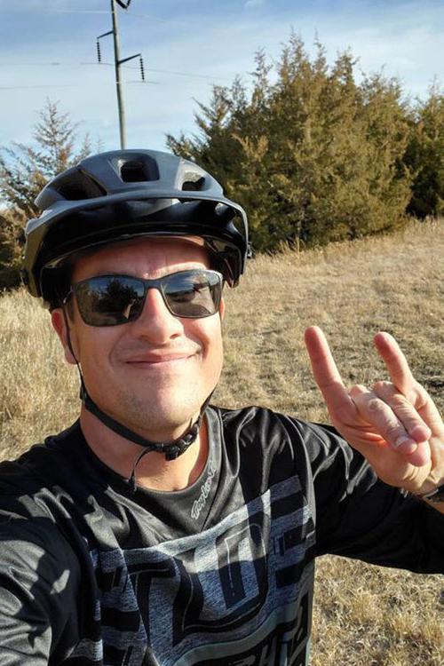 Dr. David Vail "throws the lopes" on a bike ride