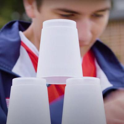 kid stacking cups